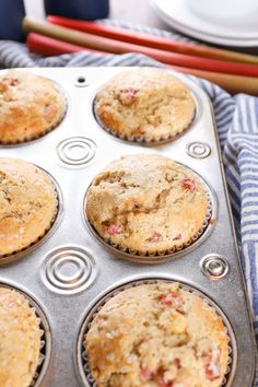 freshly baked muffins sitting in a metal pan