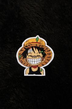 a sticker with an image of a person wearing a sombrero on it