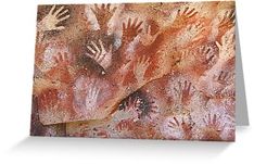 several hand prints on the side of a rock wall by corbi - art