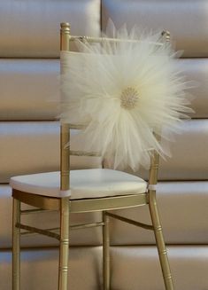 a chair with a white flower on it