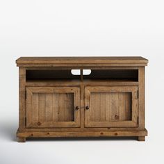 a wooden entertainment center with two doors and one drawer on the front, against a white background