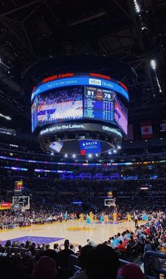 a basketball game is being played in an arena