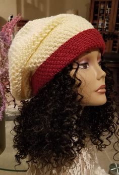 Thanks for checking out Lyns Fine Things. You will love my Creamy Ivory & Burgundy "Slouchy Sista" Crochet Winter Hat Whether you are purchasing one of my Slouch Hats, Beanies, Skull Caps, Tams or Winter hats; you are buying a hat made without any pattern or template, giving you 100% originality.  It is with great hope that this hat gives you the warmth you seek, the style you desire, and the uniqueness that only Lyns Fine Things can give you. Most Beanies are standard size unless otherwise described in titles. See wig form (pictures) for comparison.  Some hats are made for full natural hair, some are made for dreads and some would look awesome on the bald scalp.  Many hats are unisex and can be sported by all. Perfect gift for birthdays and/or the holidays! Please note that colors may var Slouch Hats, Crochet Winter Hat, Crochet Winter Hats, Crochet Winter, Slouch Hat, Slouchy Hat, Skull Cap, Winter Hat, Hat Making