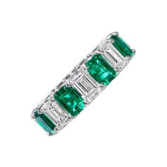 A GIA certified eternity band containing 4.76 carats of green emeralds and 4.62 carats of emerald cut diamonds, set in platinum. Emerald Cut Eternity Band, Diamonds Direct, Sapphire Wedding Band, Diamond Bar, Eternity Wedding Band, Eternity Band Diamond, Emerald Cut Diamonds, Green Emerald, Eternity Band