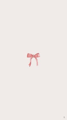 a pink bow on top of a white wall