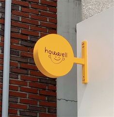 there is a yellow sign on the side of a building