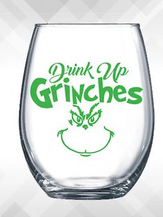 a glass with the words drink up grines on it