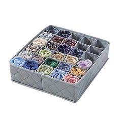 a box filled with lots of different colored hair ties