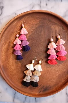 the diy multicolor tassel earrings are displayed on a wooden tray with text overlay