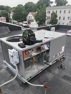 an air conditioner sitting on top of a roof