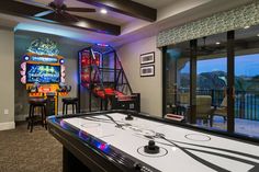 a game room with an air hockey table