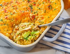 a casserole dish with broccoli and cheese