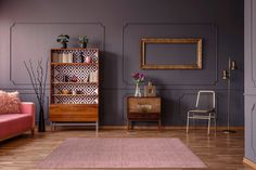 a living room with purple walls and wooden floors