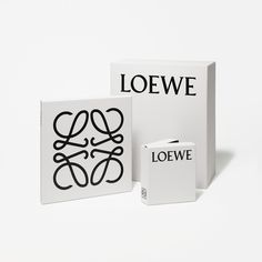 two boxes that are sitting next to each other on a white surface with the words loewe printed on them