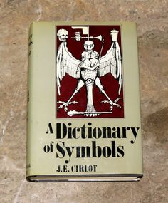 a dictionary of symbols by j e cirllot on a marble surface with the title'a dictionary of symbols '