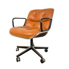 an orange leather office chair with wheels and casteors on the back, against a white background