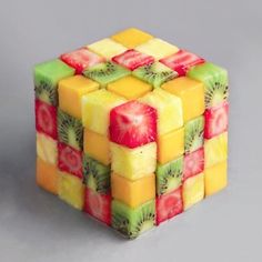 a cube made out of fruit with kiwi slices