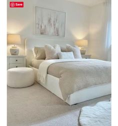 a white bed sitting in a bedroom on top of a carpeted floor next to two lamps