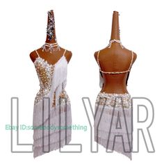 two women's belly dance costumes, one in white and the other in gold