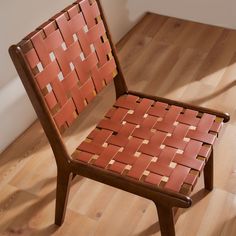 a wooden chair sitting on top of a hard wood floor