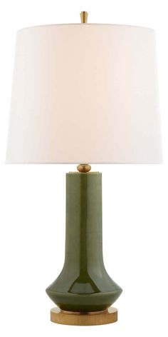 a green table lamp with a white shade