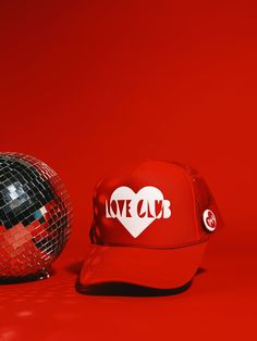 Love is in the air! Elevate your Valentine's Day with one of our favorite new truckers! Each hat comes with a limited edition A+H heart button on either an Olive/Pink, Red/White, or Blue/Red hat. This hat is made to order and will ship in 3-5 business days MADE TO ORDER PRODUCTS ARE FINAL SALE Love Club, Heart Button, Red Hat, Love Is In The Air, Red Hats, Pink Love, Pink Red, Bachelorette Party, Final Sale