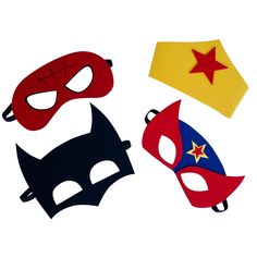 three masks with different colors and shapes are shown on a white surface, one has a red star in the middle