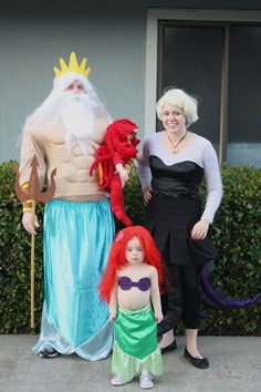 two women and a child are dressed up as the little mermaid and king nala