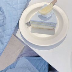 a piece of cake sitting on top of a white plate next to a knife and fork