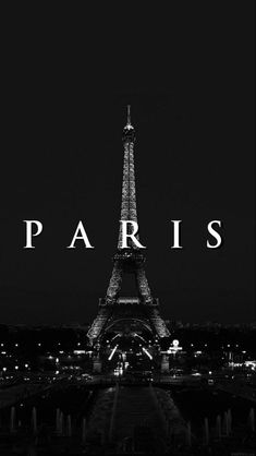 the eiffel tower lit up at night in black and white with the word paris over it