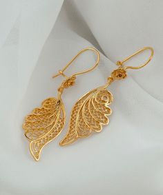 Gold Angel Wing Silver Dangle Earrings 925 Sterling Silver Gold Plated Filigree Floral Earrings Women Handmade Wing Drop Earrings Jewelry Edwardian earrings, anniversary gift her, best friend gift, sparkly earrings Material: 925 Sterling Silver 18K Gold Plated (NICKEL FREE) Length, Drop and Width: 5.5cm X 3.5cm X 1.6cm // 2.15 Inches X 0.6 Inches UPS - FREE, FAST AND TRACKABLE SHIPPING FOR ALL EU COUNTRIES AND USA. Embrace celestial elegance with our Gold Angel Wing Silver Dangle Earrings, a divine fusion of ethereal charm and artisan craftsmanship. Crafted from high-quality 925 Sterling Silver and delicately plated in gold, these enchanting filigree floral earrings are a testament to meticulous handmade artistry. The angel wing design adds a touch of celestial grace, symbolizing protectio New Model Earrings Gold, New Gold Earrings Designs, Elegant Gold Jewelry, Edwardian Earrings, Gold Earing, Gold Dangling Earrings, Unique Gold Jewelry Designs, Delicate Gold Jewelry, New Gold Jewellery Designs