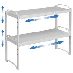 a white shelf with blue arrows pointing to the top and bottom shelves on each side