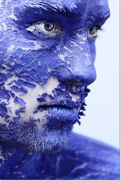 a man with blue paint on his face and the words instagramm above him