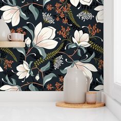 the wallpaper is decorated with flowers and leaves