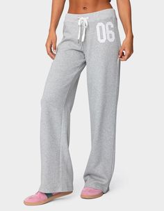 Reach Your Ultimate Level Of Coziness, While Still Feeling On-Trend With These Perfect Sweatpants. Sweatpants. Straight Leg Fit. Adjustable Tie Waist. Embroidered Patch. 50% Cotton, 50% Polyester. Model Wears Size S. Model Height Is 5'8. Item Care: Machine Wash At Maximum 30ºc, Do Not Bleach, Do Not Tumble Dry, Iron At A Maximum Of 110ºc, Do Not Dry Clean. | Edikted 06 Sweatpants Good Sweatpants Brands, Shirts To Wear With Sweatpants, Aeropostale Flare Sweatpants, Good Sweatpants, Cute Sweat Pants, 2000s Sweatpants, Sweatpants Graphic, Edikted Tops, Garage Sweatpants