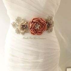 "Wedding belts and sashes, wedding dress sash, Bridal sash/belt, Maternity sash, Rustic sash, This vintage bridal sash/belt will make a beautiful addition to your wedding dress and wedding theme. The wedding belt/sash is embellished with handmade flowers centered with pearl buttons and finished on both sides with rhinestone appliques. The double faced satin sash ribbon is approximately 3.5 yards long. The ribbon is available in many other shades of neutral colors. Colors used: Mauve (big flower Wedding Dress With Sash, Elegant Fitted Sash With Belt Included, Elegant Wedding Sash With Belt, Wedding Belts And Sashes Classic, Fitted Bridal Belt With Sashes For Wedding, Bridal Belts And Sashes Simple, Wedding Belts And Sashes Vintage, Fitted Sashes Bridal Belt For Wedding, Fitted Bridal Sashes For Bride