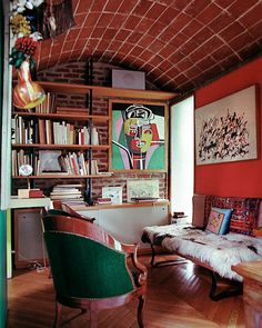 a living room filled with furniture and bookshelves