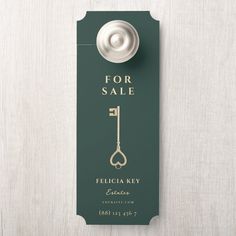 a door hanger with a bottle opener on it and the words for sale written in gold