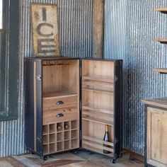 an old fashioned wine rack in the corner of a room with corrugated walls and wooden floors