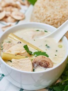 a white bowl filled with soup and vegetables