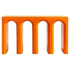 an orange table with three arches on it