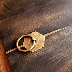 a wooden table with a ring on it