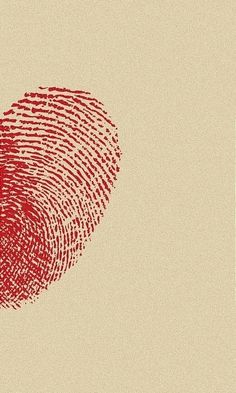 a fingerprint in the shape of a heart on a beige background with red ink