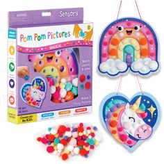 two kits with unicorns and rainbows hanging from strings