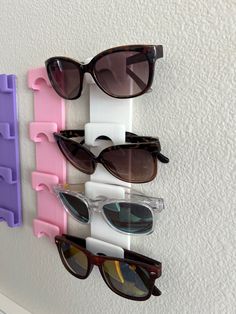 Introducing our innovative Sunglasses Holder - the ultimate solution for organizing and storing your sunglasses, eye glasses, and safety glasses. Say goodbye to clutter and hello to a tidy and efficient space! Designed to be attached to any wall or door, this Sunglasses Holder is a versatile accessory that will transform the way you store and access your eyewear. This holder offers convenience and functionality like no other. One of the standout features of our Sunglasses Holder is its ability t Lego Glasses Holder, Sunglasses Display Ideas, Glasses Storage Ideas, Funky Bathroom, Sunglasses Display, Sunglasses Holder, Safety Glasses, Sunglass Holder, Eyeglass Holder