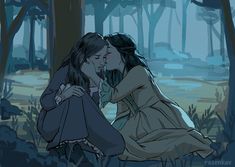 two women are kissing in the woods