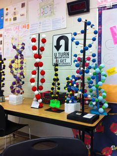 a table with some balls on it in front of a sign that says u turn