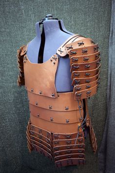 a leather armor is displayed on a mannequin