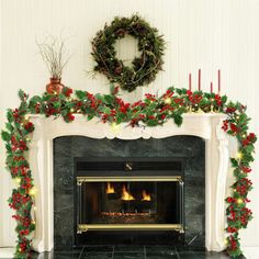 a fireplace decorated for christmas with wreaths and lights