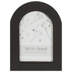 a black frame with white flowers in it